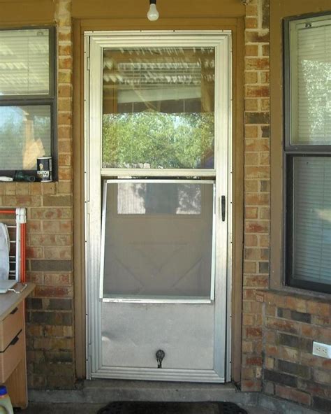 how to lower the window on a storm door